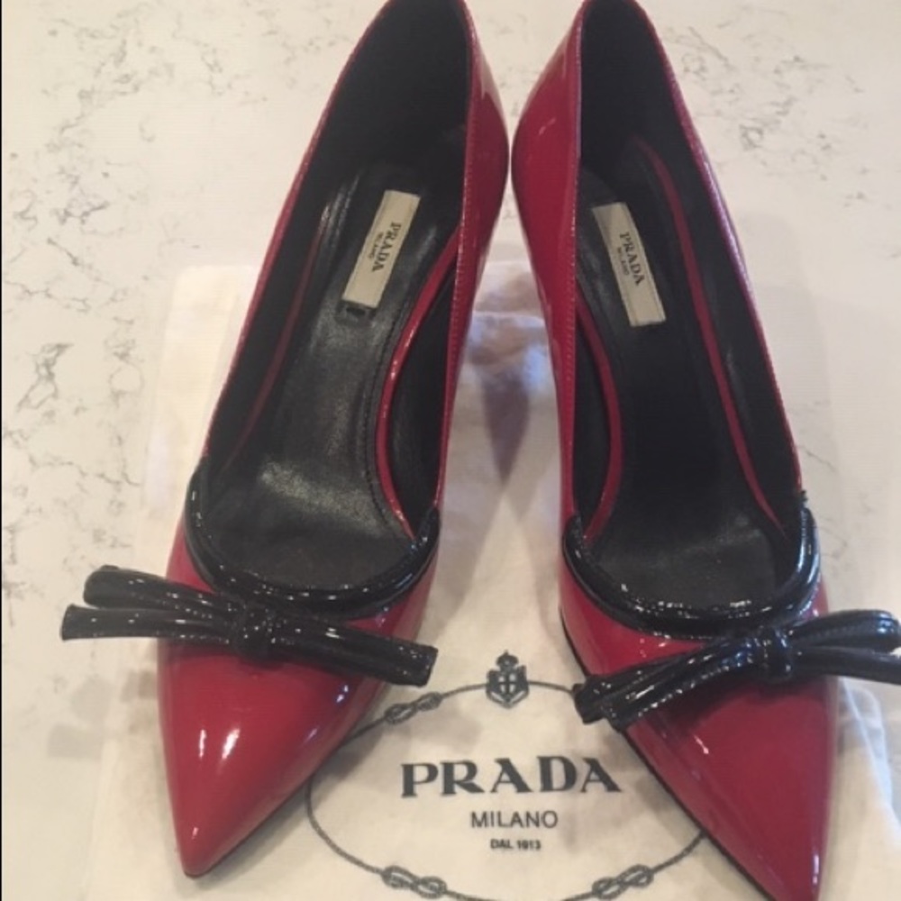 Prada pumps- red with black bows.